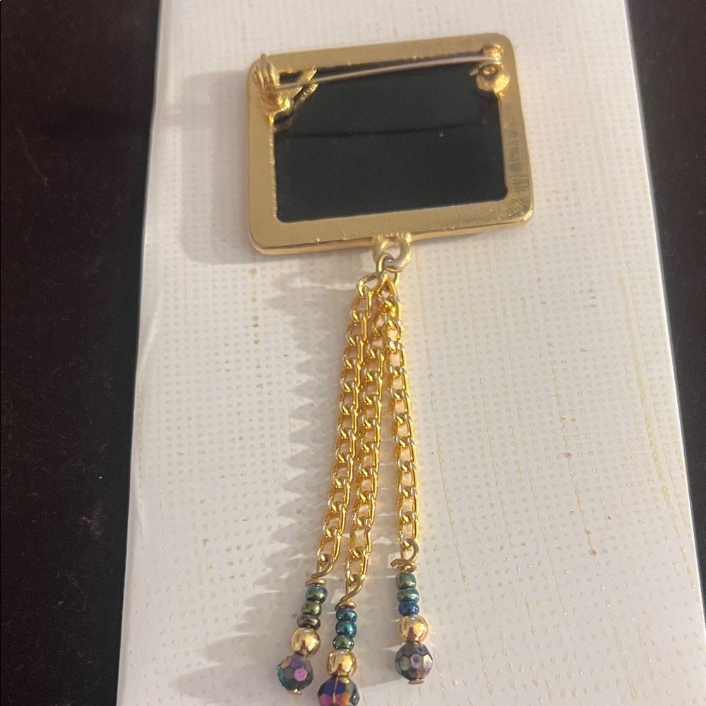 Elegant Black and Gold Brooch with Chain Tassels - Picture 3 of 3